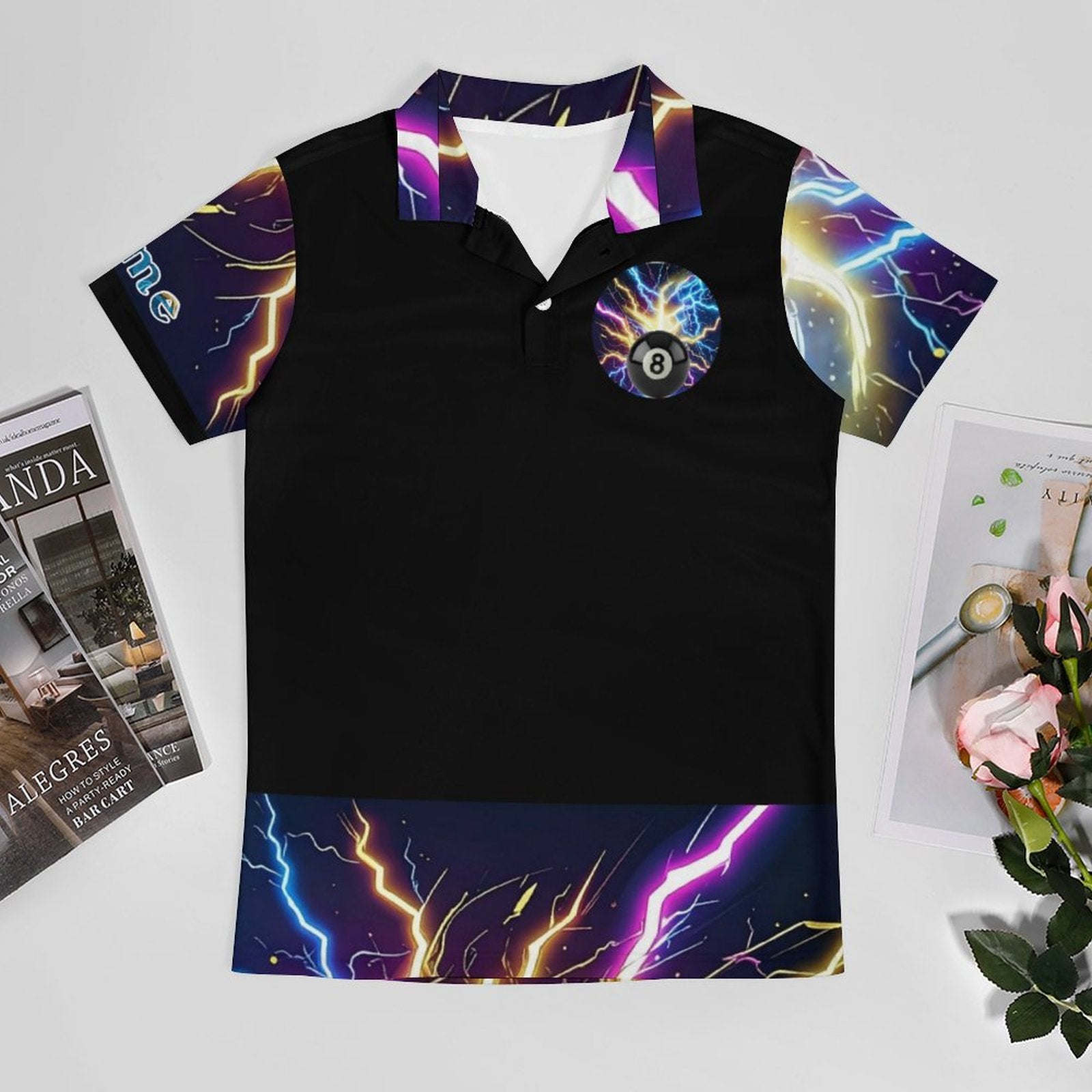 Black polo shirt with colorful lightning designs on a white surface