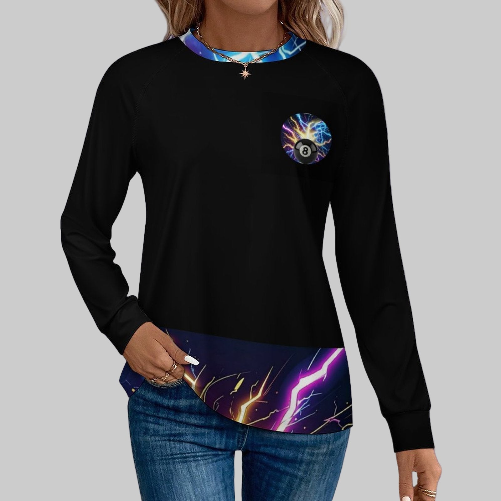 Black long-sleeve shirt with colorful pocket design worn by a person on a white background